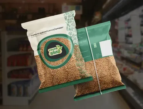 Product packaging for a food brand displayed in a retail setting, featuring eco-friendly design and Tamil branding for sesame seed packets.