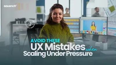 UX designer sitting at a workstation with dual monitors, with the text “Avoid these UX mistakes when scaling under pressure” overlaid. Office environment in the background.