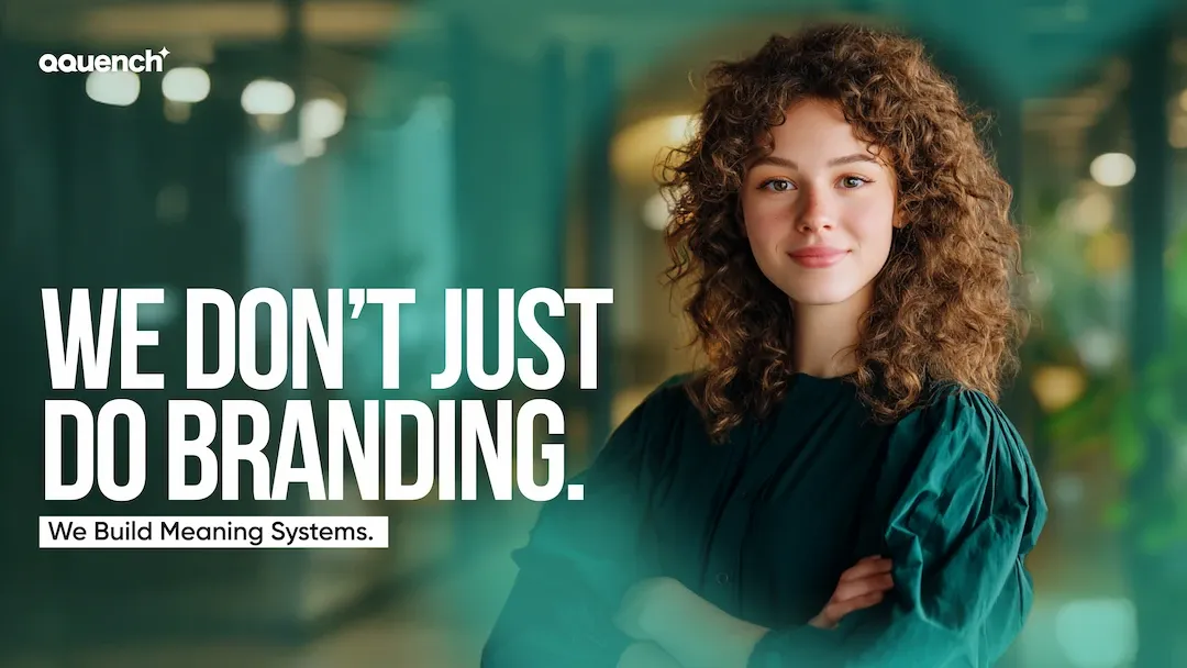 Confident UI UX Designer, standing in an office hallway. Text on the left reads: 'We don’t just do branding.' Below it, a subtitle in a white box states: 'We Build Meaning Systems.'