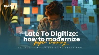 Man wearing glasses working at a desk surrounded by colorful sticky notes on glass. The text overlay says: 'You Are Not Too Late To Digitize: how to modernize paper training.' Subtext at the bottom reads: 'The best time to digitize? Right now.'